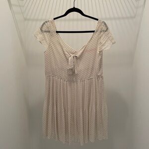 Cream polka dotted babydoll dress by Pinky Otto. Slightly sheer.